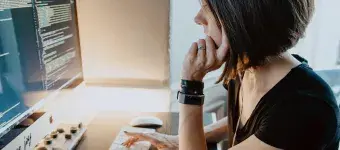 Woman sitting in front of computer