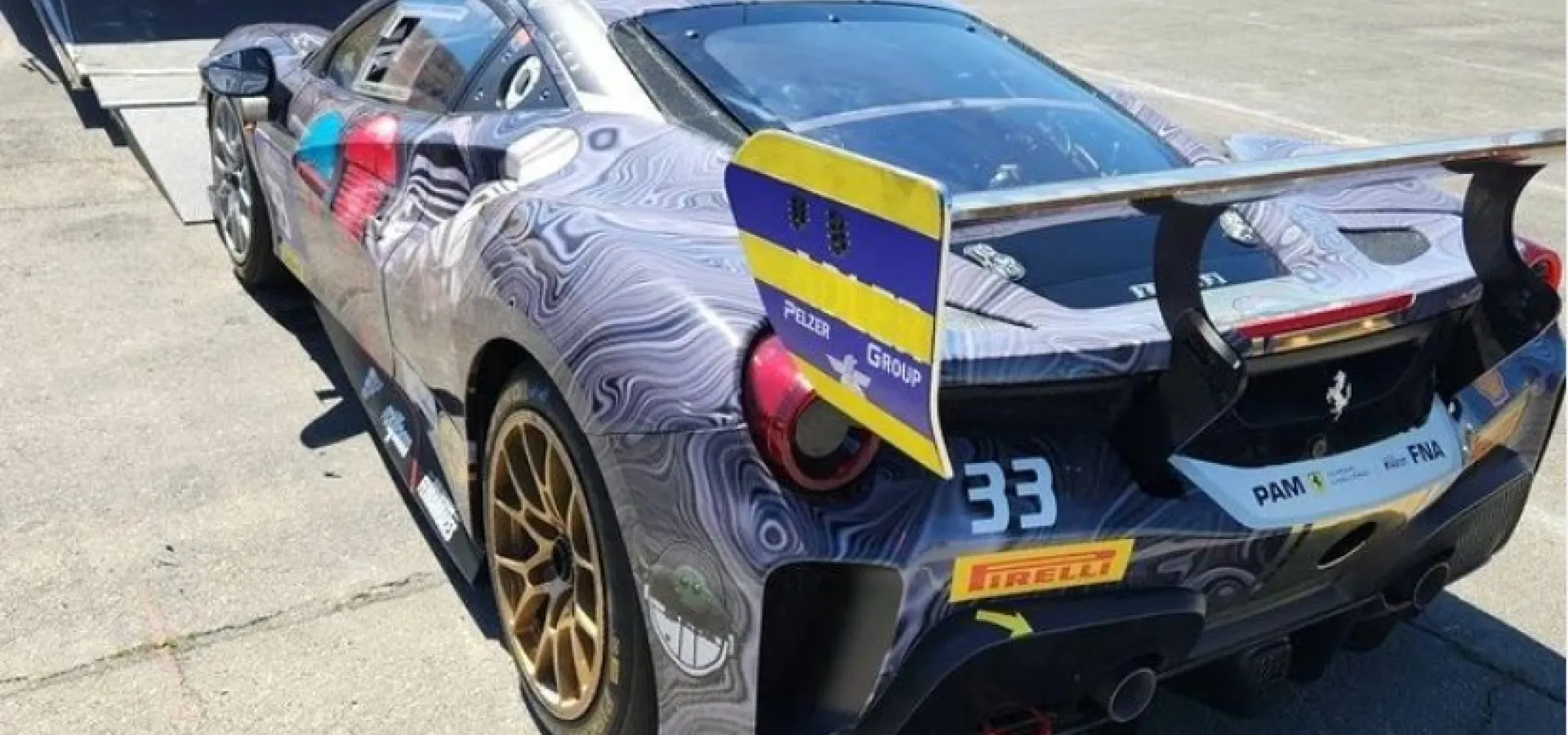 Sports car gets into a transport truck