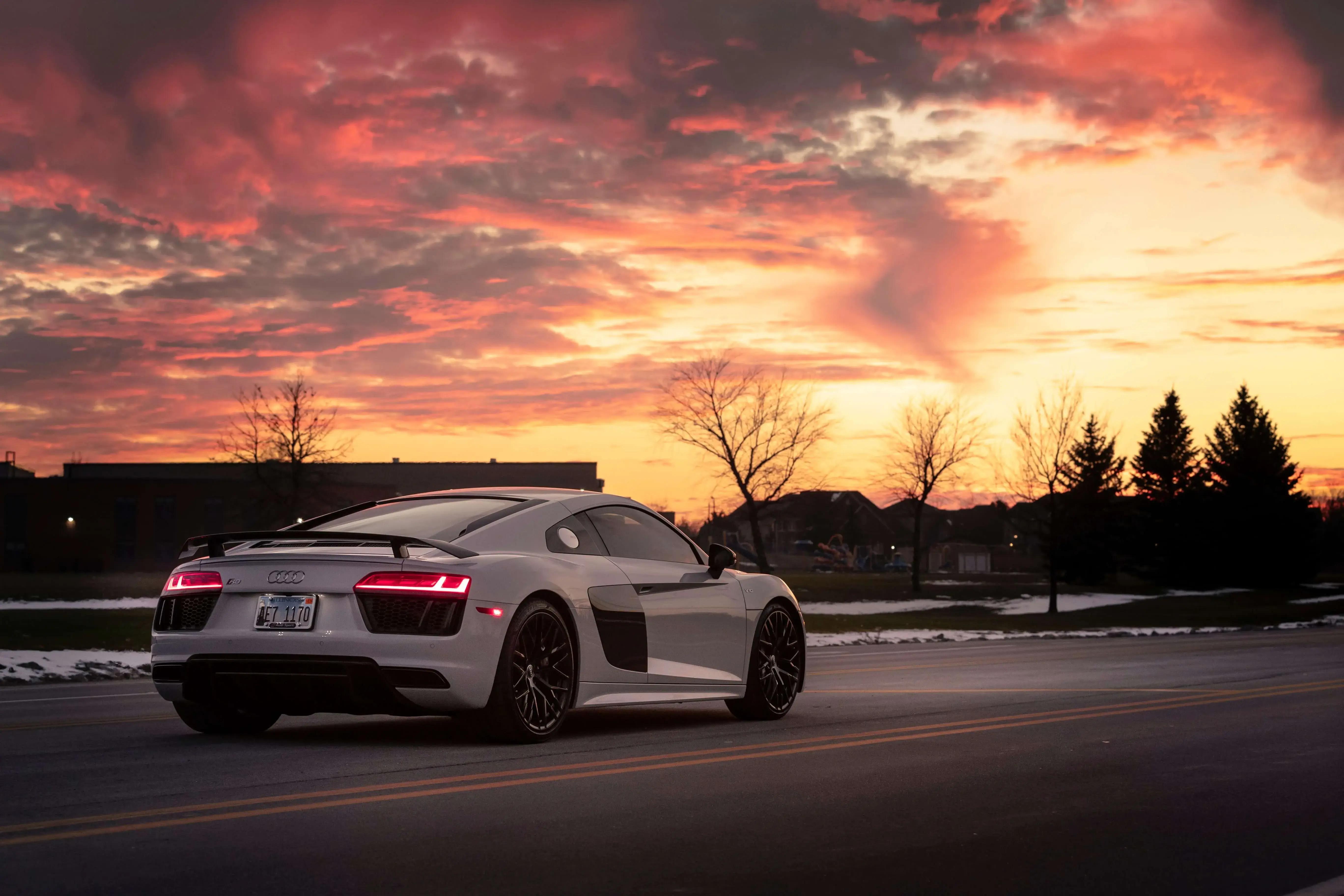 A White Sports Car on the Road A White Sports Car on the Road