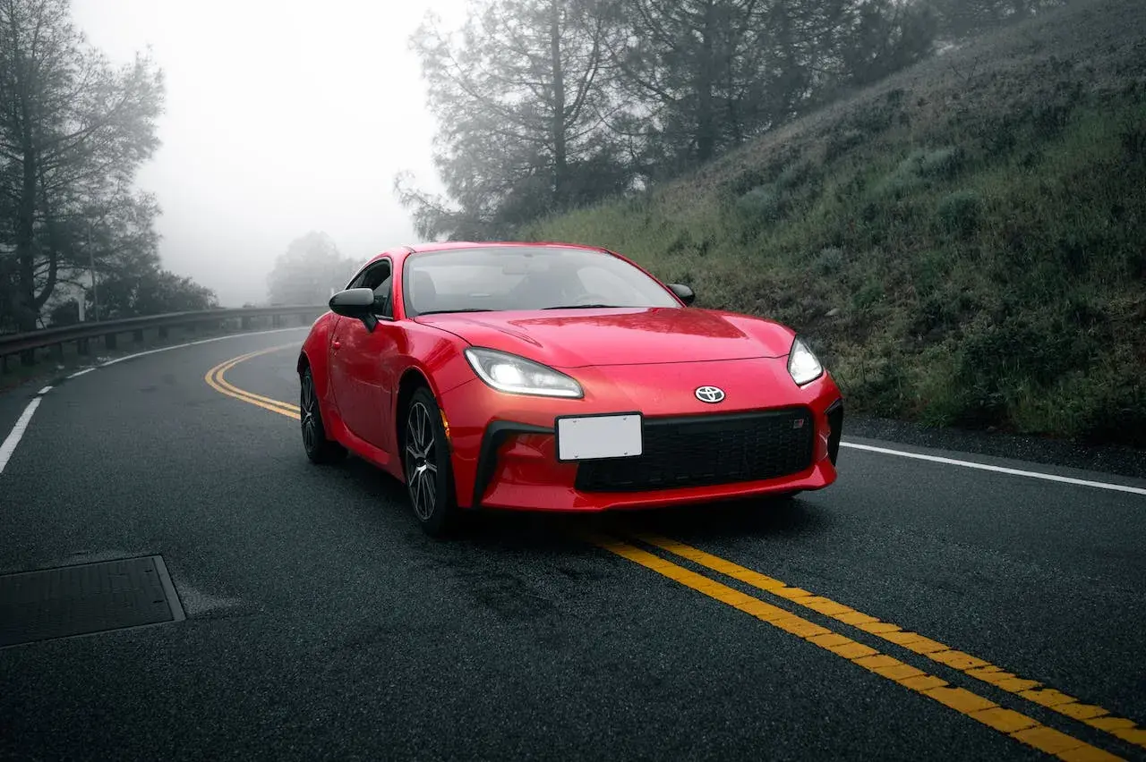 Red Toyota Camry on the road Red Toyota Camry on the road