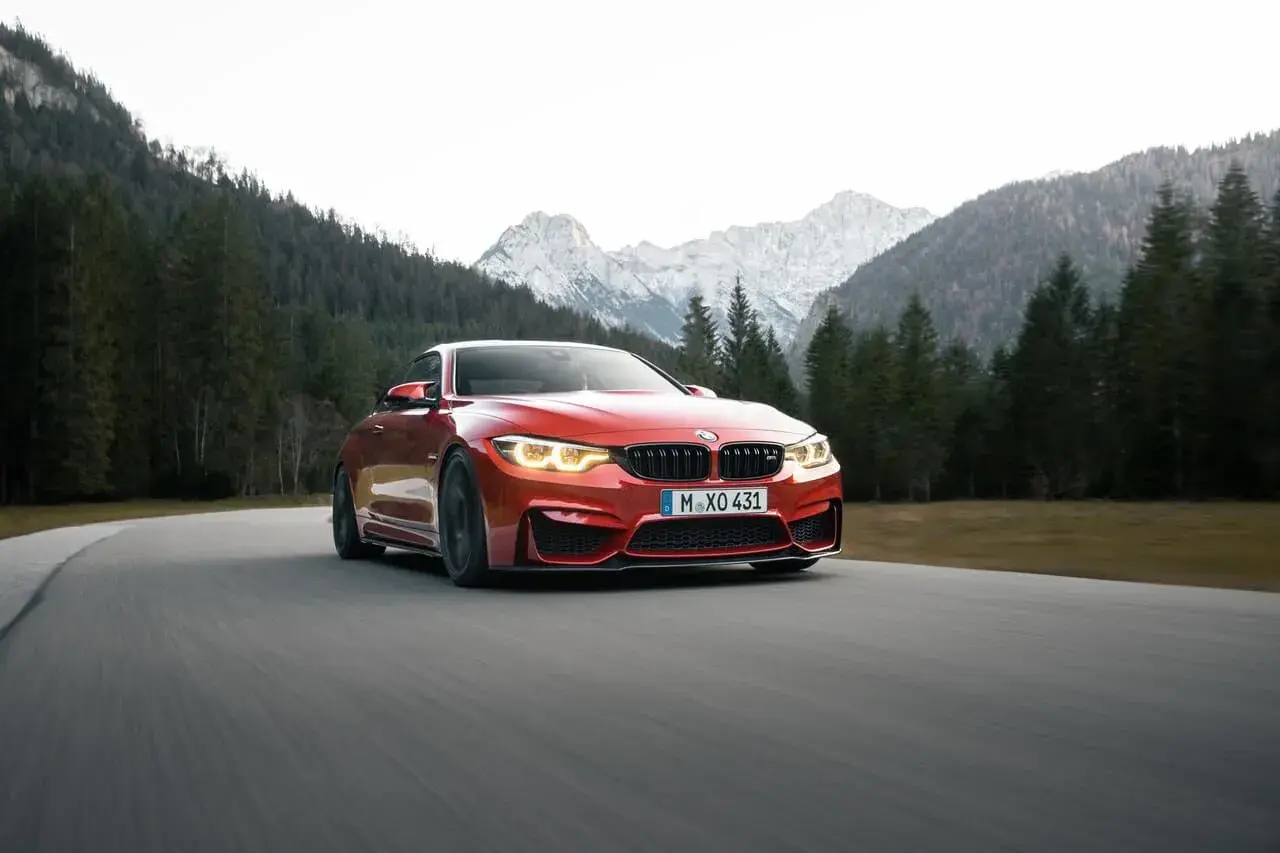 Red BMW on the road Red BMW on the road