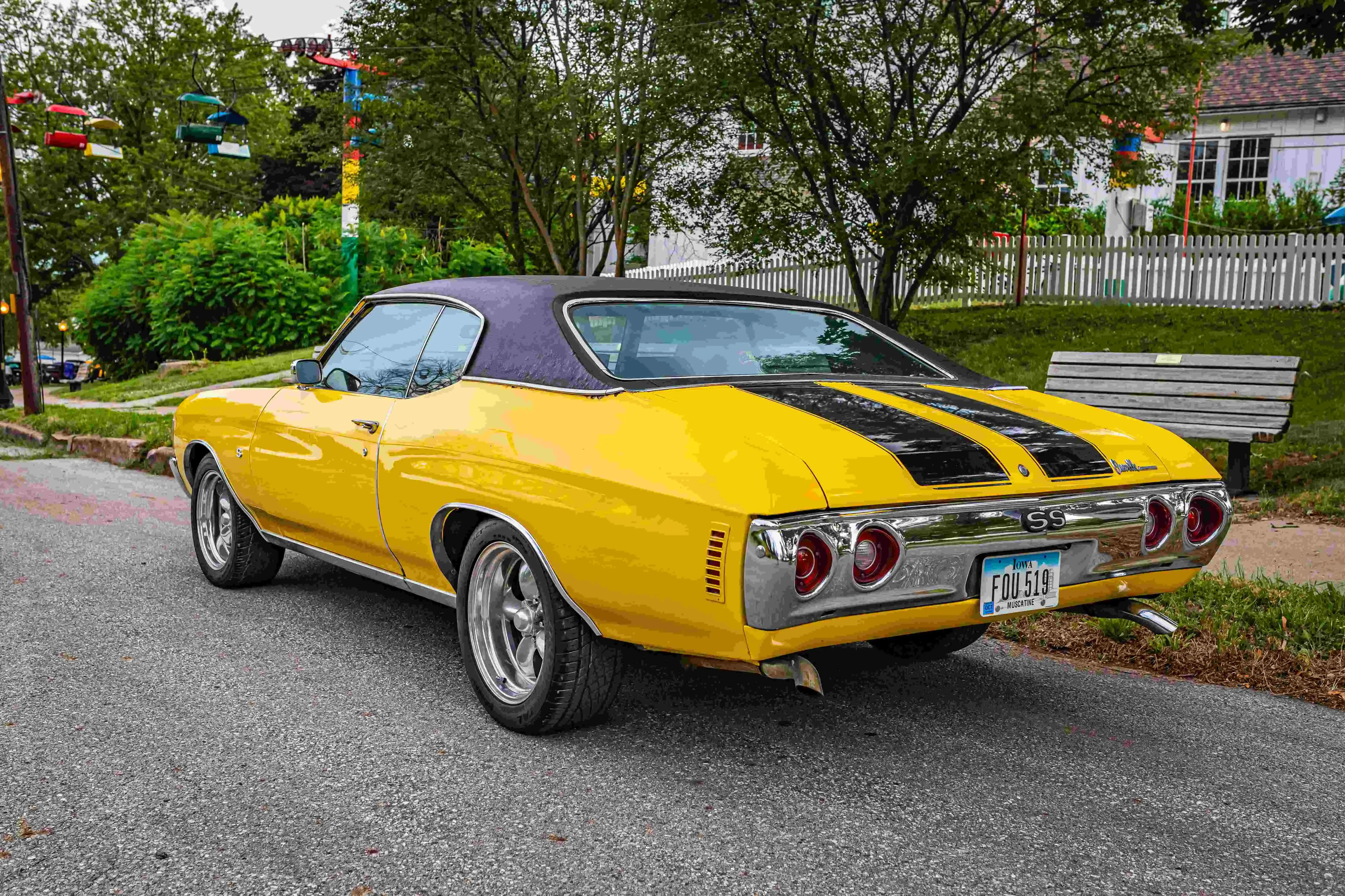 Yellow vintage car parked on the road Yellow vintage car parked on the road