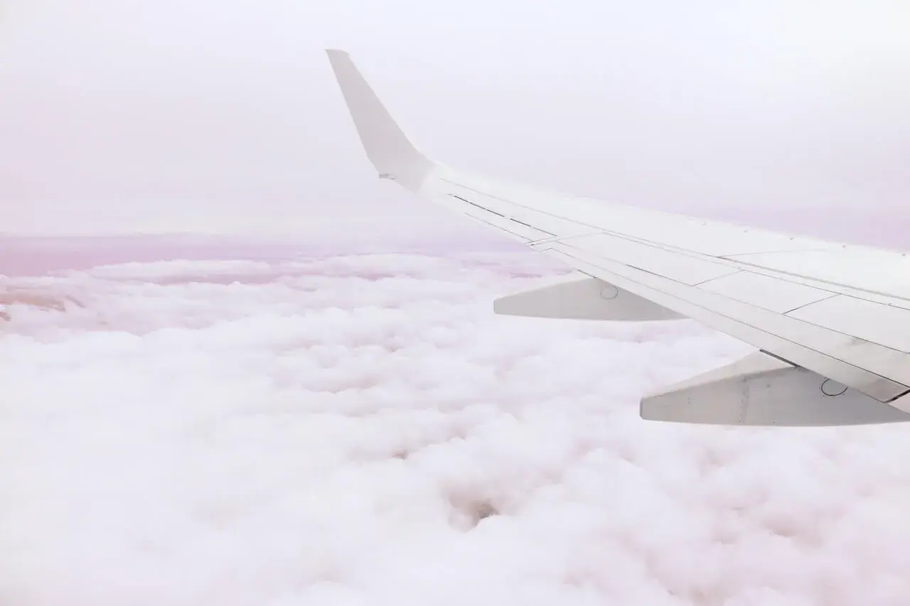 A plane flying above the clouds A plane flying above the clouds