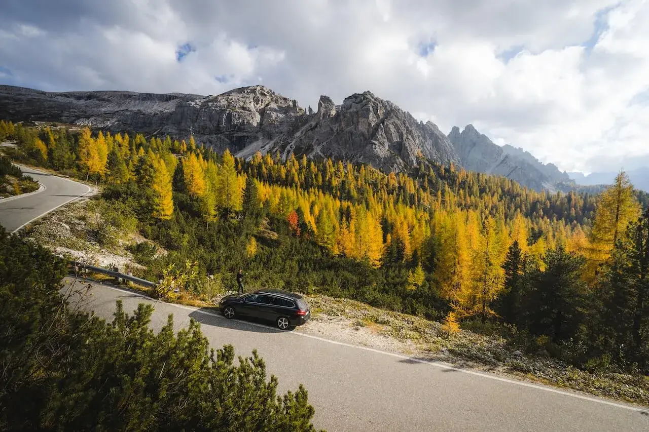 A car crossing mountains in Montana A car crossing mountains in Montana