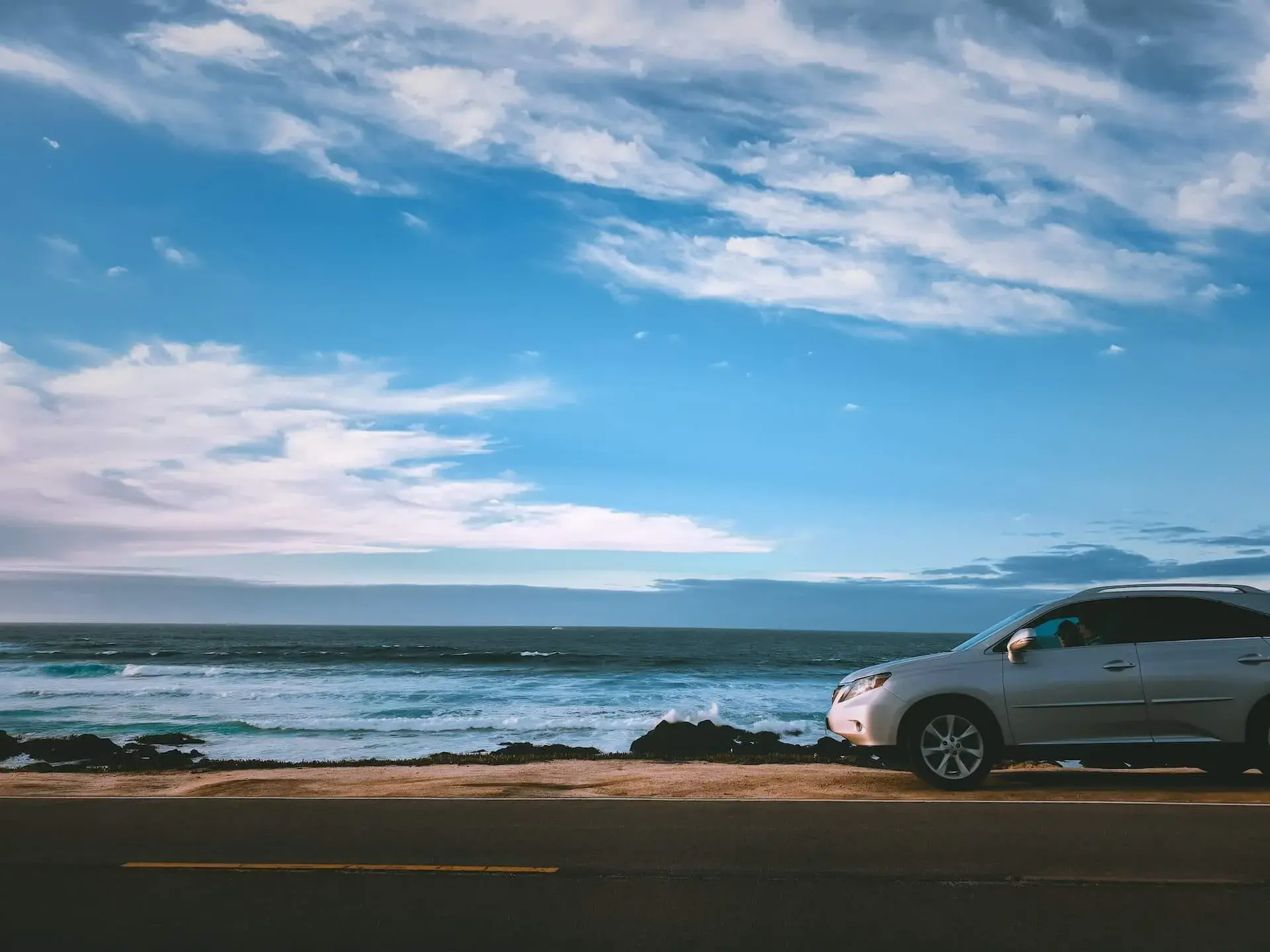 A car parked on the shore A car parked on the shore