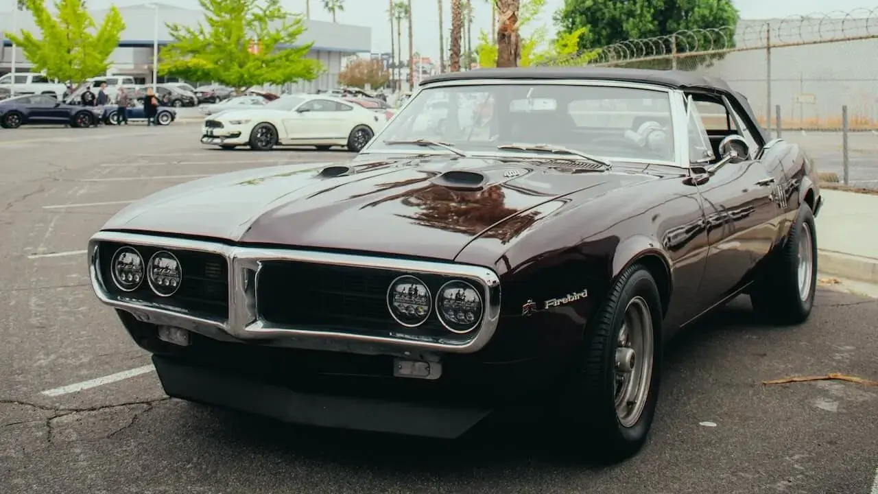 A Classic Pontiac Firebird on a Parking Lot A Classic Pontiac Firebird on a Parking Lot