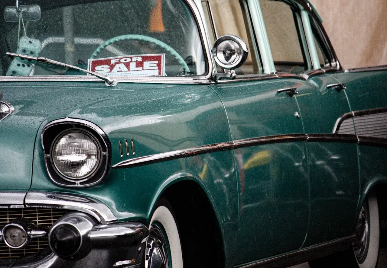 green car with for sale sign green car with for sale sign