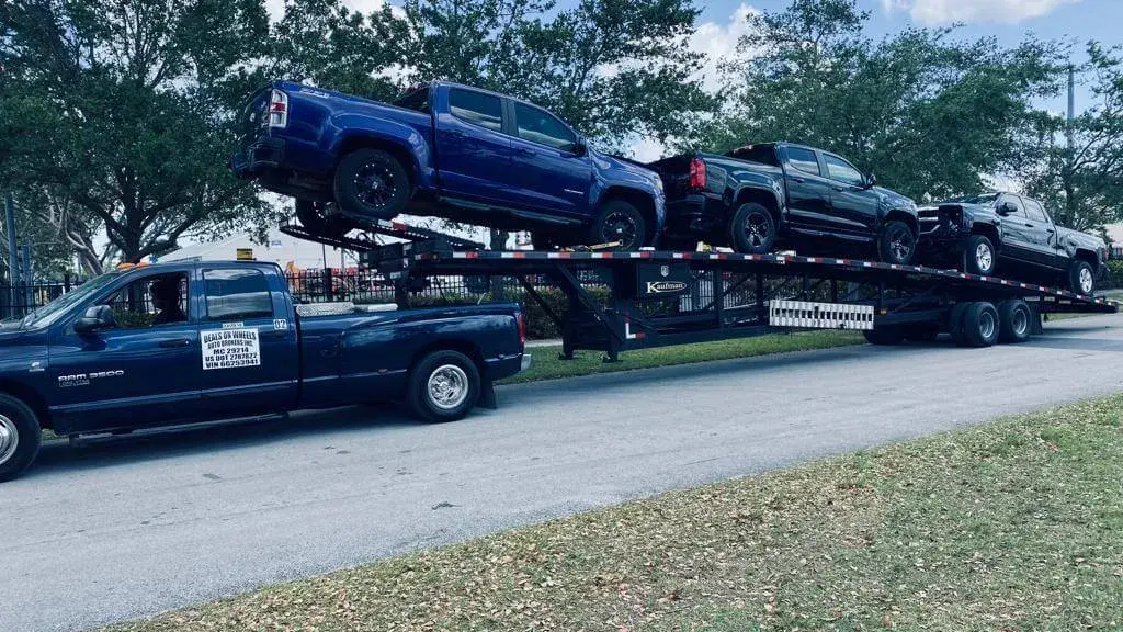 Jeep with platform carrying cars Jeep with platform carrying cars