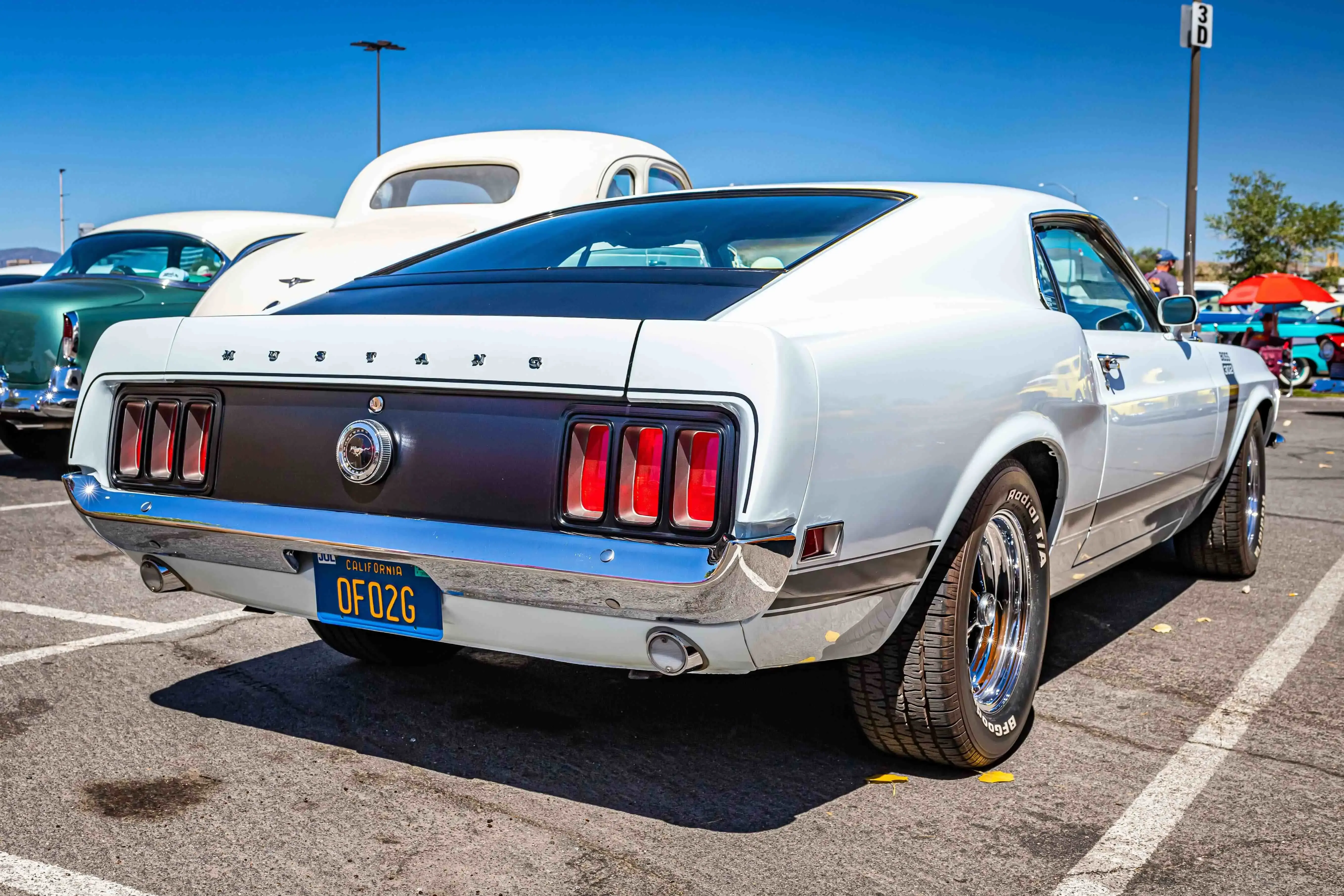 White mustang on a parking lot White mustang on a parking lot