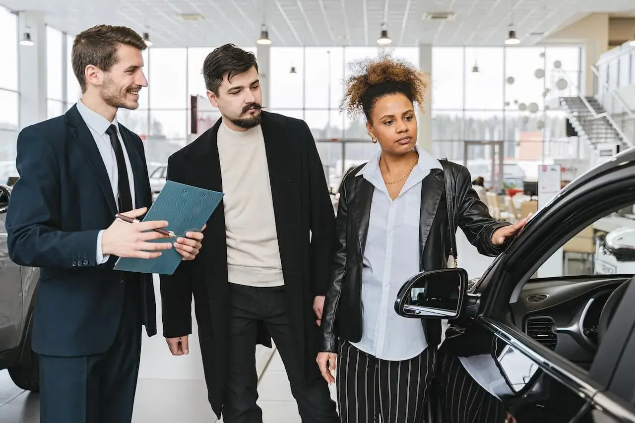 A Couple at a Car Dealership A Couple at a Car Dealership