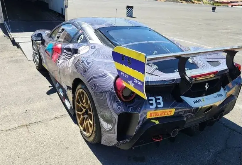Sports car gets into a transport truck Sports car gets into a transport truck