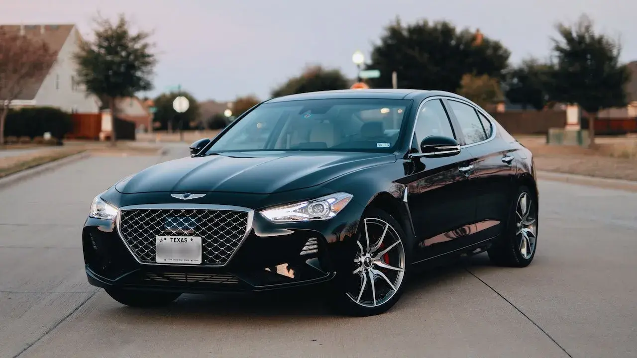 Black sedan on the road Black sedan on the road