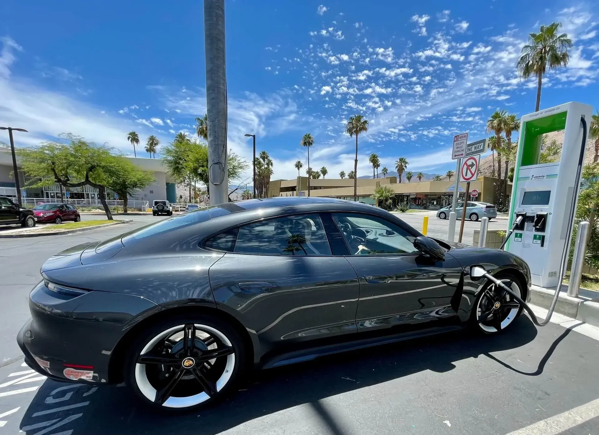 charging an electric car charging an electric car