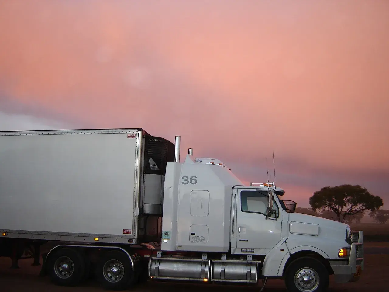 White truck behind him sunset White truck behind him sunset