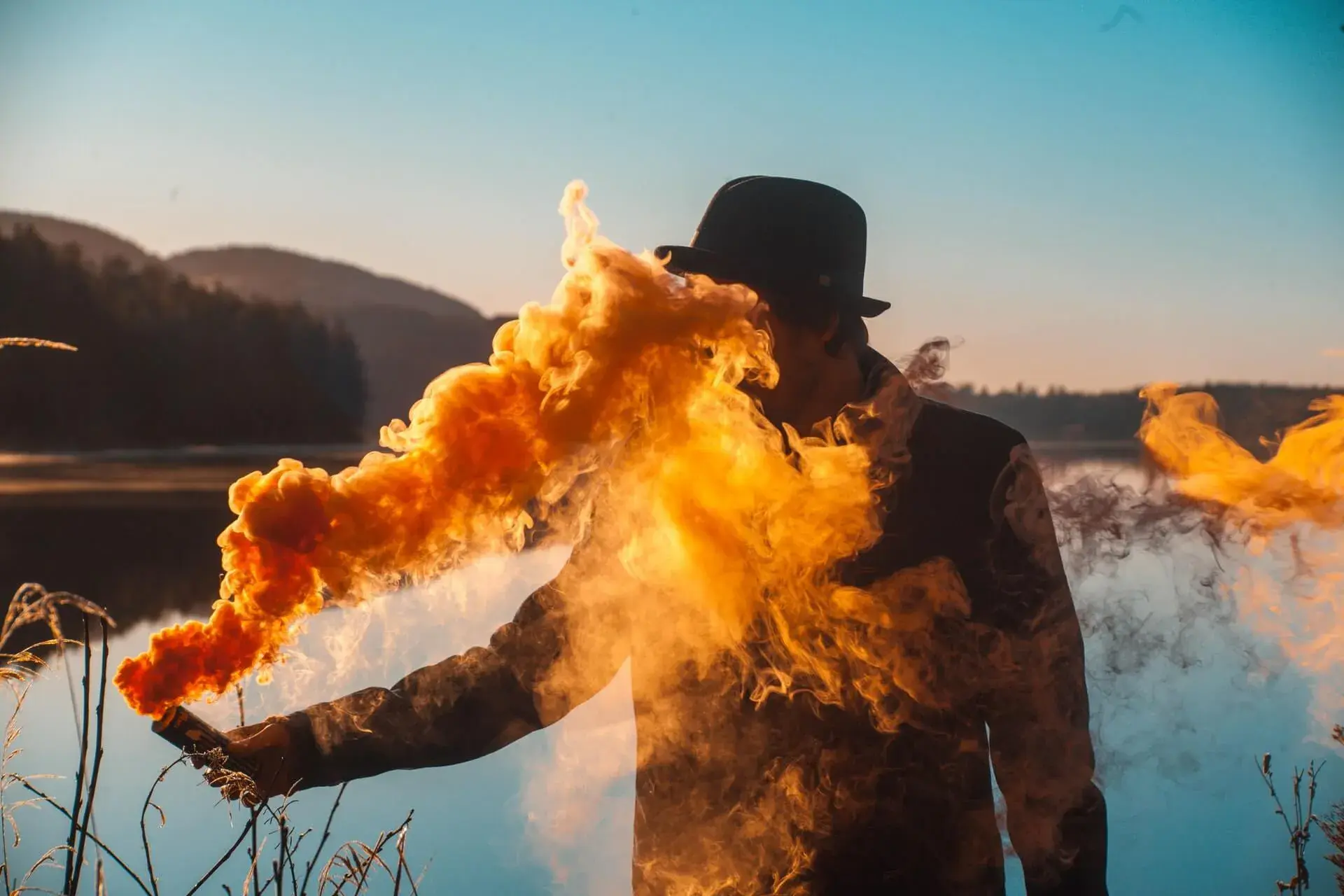 Person Holding a Smoke Bomb Person Holding a Smoke Bomb