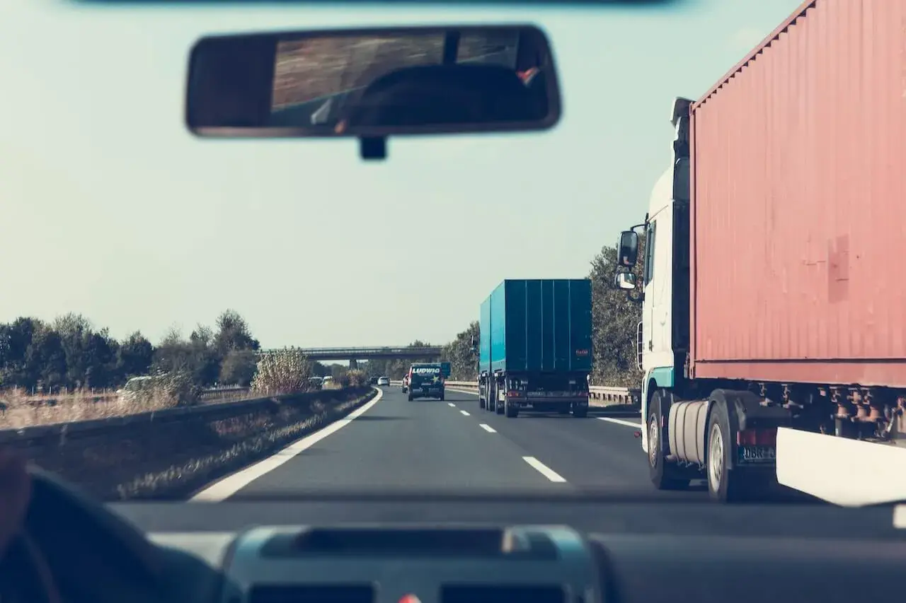 Blue and red truck on the road Blue and red truck on the road